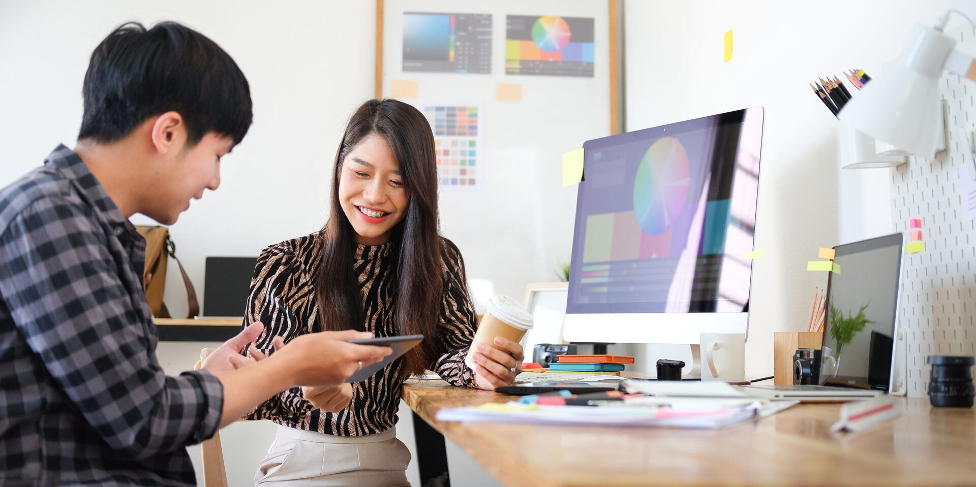 Team of professional designers working with new startup project in modern office.